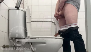 In the Hospital Toilets, a Guy Pisses Into a Cup for a Urine Sample, Then Gets Horny, Jerks-off and Cums